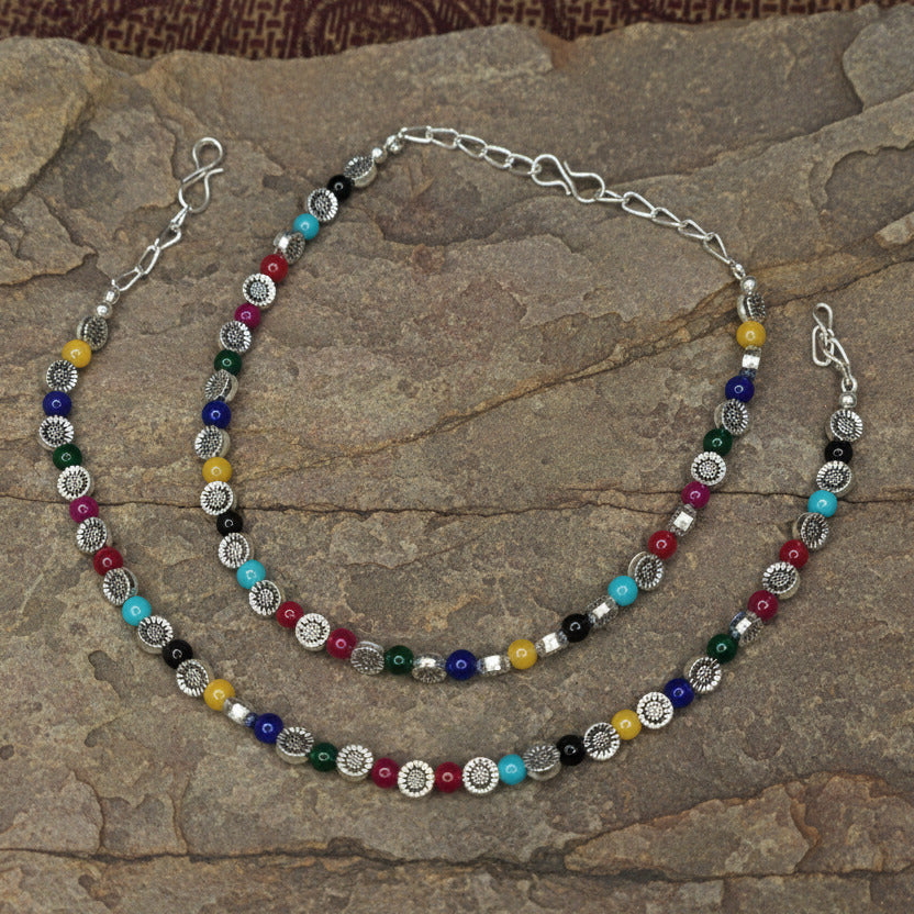 Necklace with multicolored beads on a white background