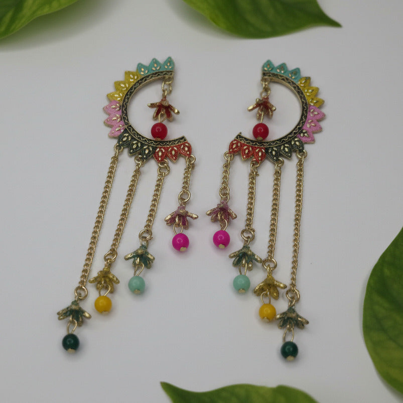 Pair of decorative earrings with colorful beads on a white background