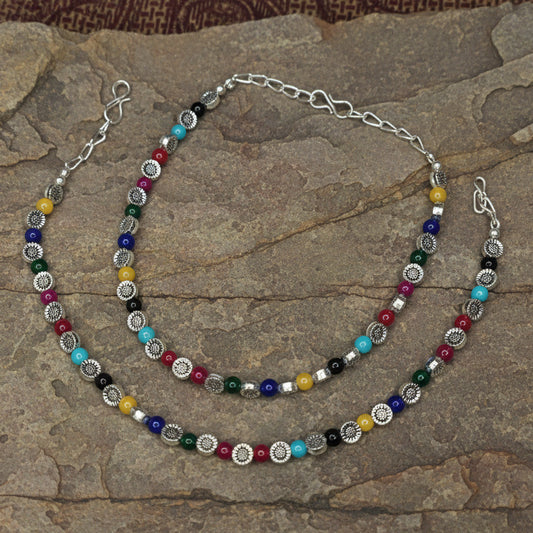 Necklace with multicolored beads on a white background