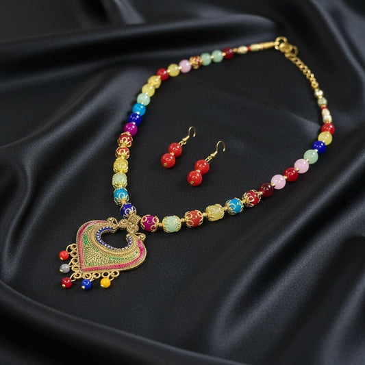 Colorful beaded necklace and earrings on a black background