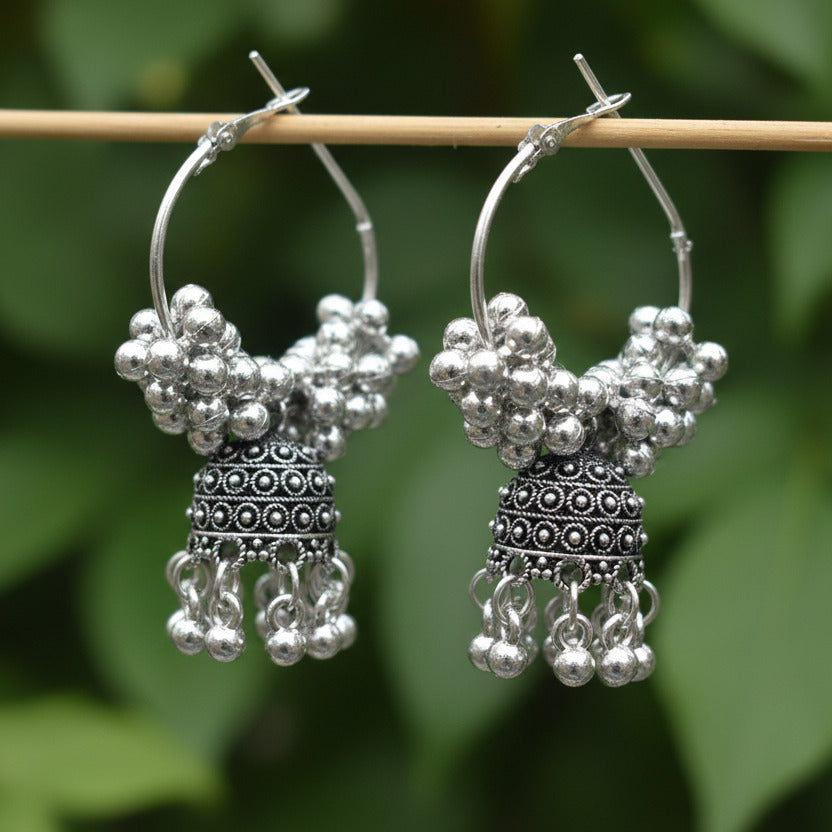 Silver beaded earrings on a white background