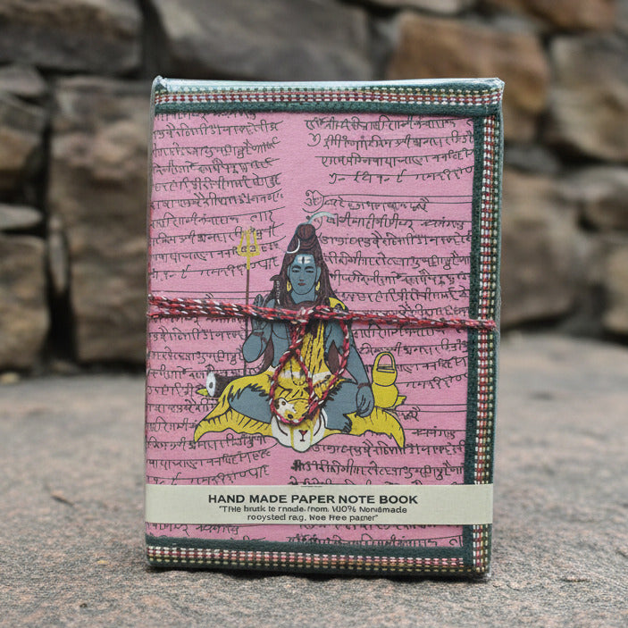 Handmade paper book with fairy tale design on a textured surface